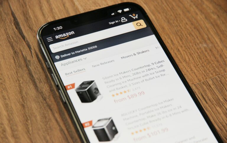Pakistani entrepreneur researching Amazon FBA business opportunities on a laptop