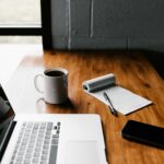 Pakistani freelancer working from home on a laptop in a modern home office setup