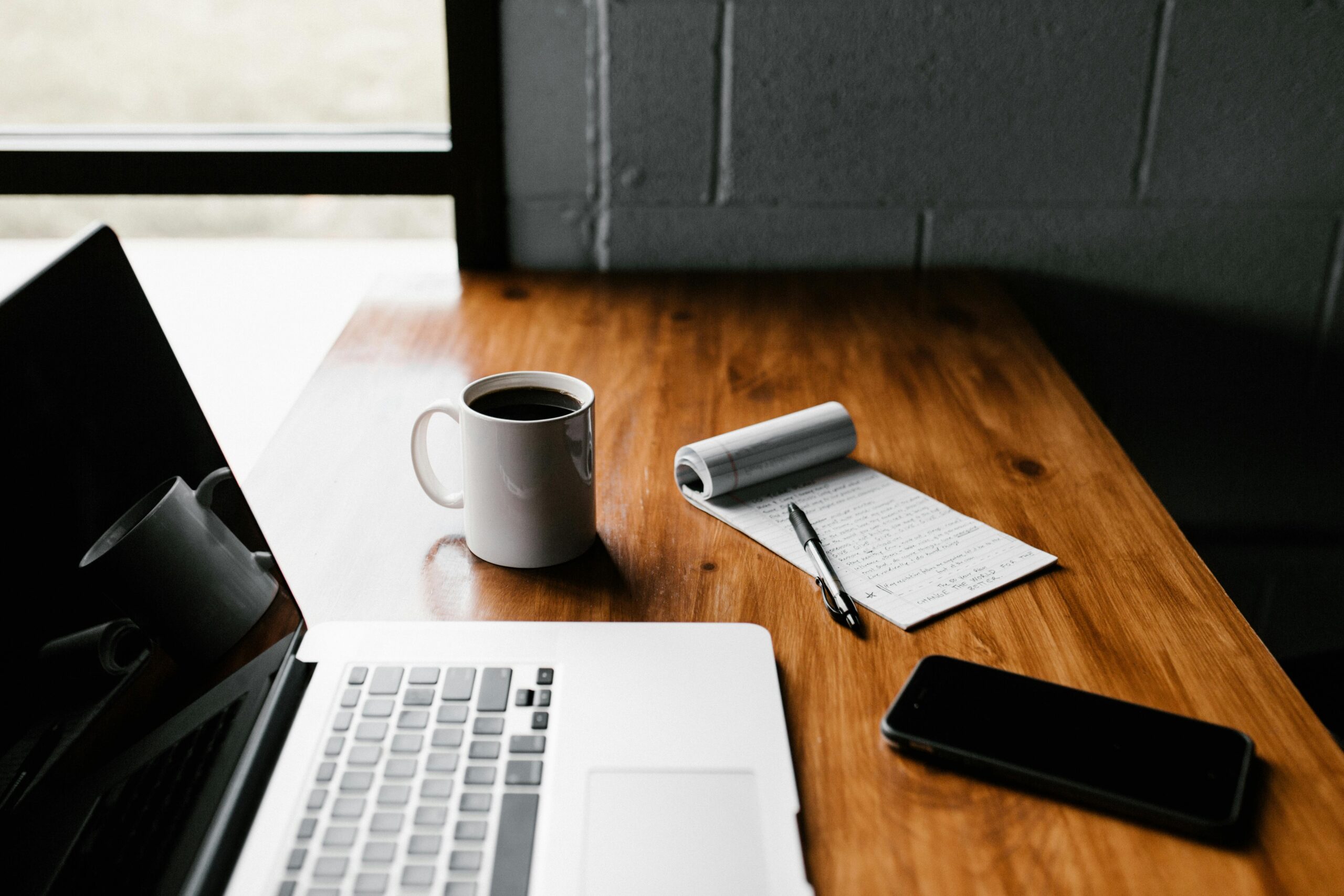 Pakistani freelancer working from home on a laptop in a modern home office setup